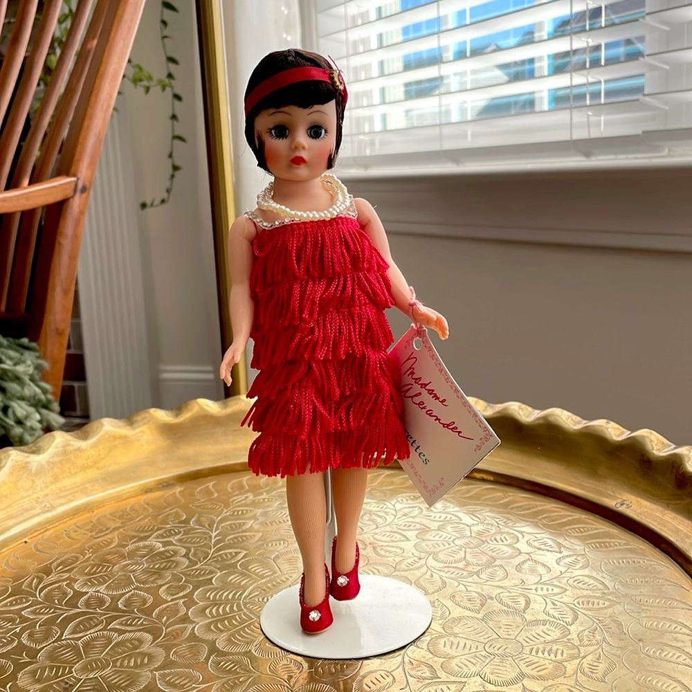 Madame Alexander 8 inch vintage Flapper doll with box, stand and inserts.